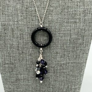 Onyx ring, sterling silver, purple Swarovski necklace.